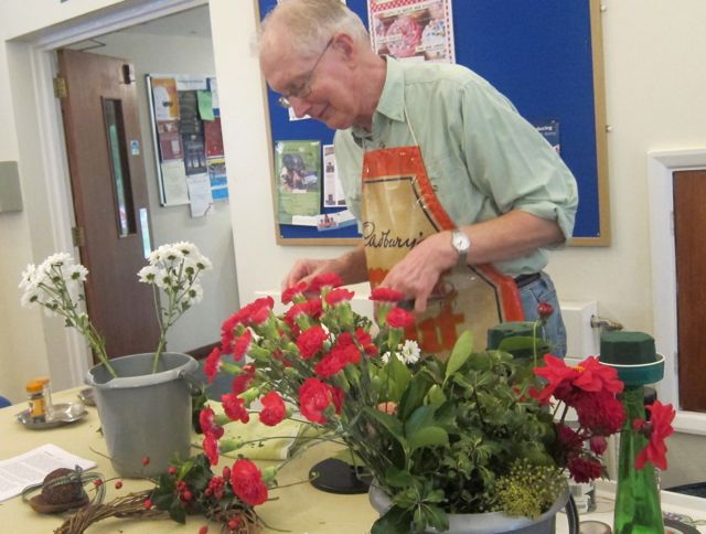 Alan Page was busy arranging flowers at the Christmas Fayre at St. Martin.