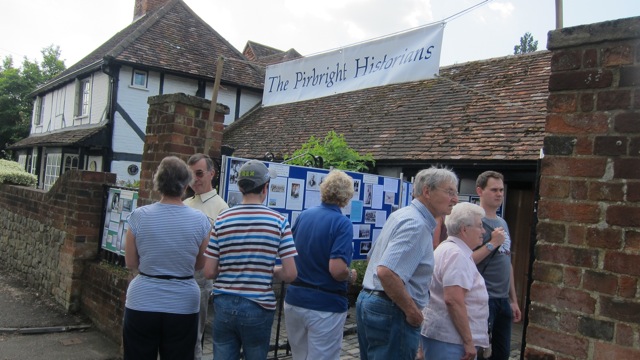 Pirbright villagers reading about history of local families and Pirbright during the war.