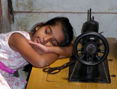 Sweatshop? Not really; just a bored schoolgirl in her father's workshop