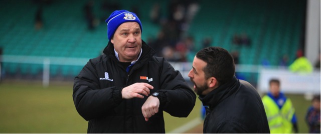 Eastleigh’s manager Richard Hill asks the 4th official how much of the 6 minutes added time was actually played.