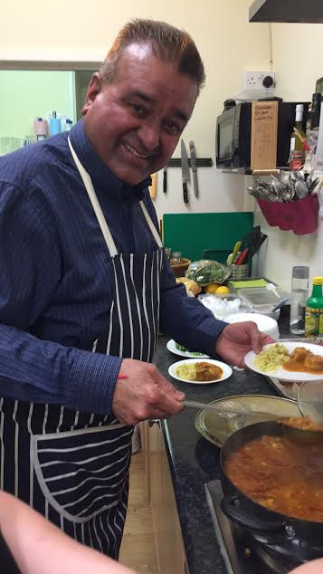 Raj preparing curry using his own Gold Dust ingredients at Bay Leaves Larder. At Chandler's Ford