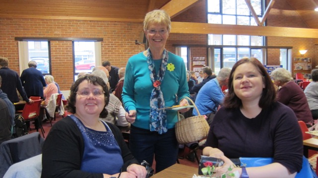 Jennifer (centre) with her basket - selling raflle tickets at The Coffee Room. With Chandler's Ford authors: Allison Symes (left) and Emma Golby-Kirk.