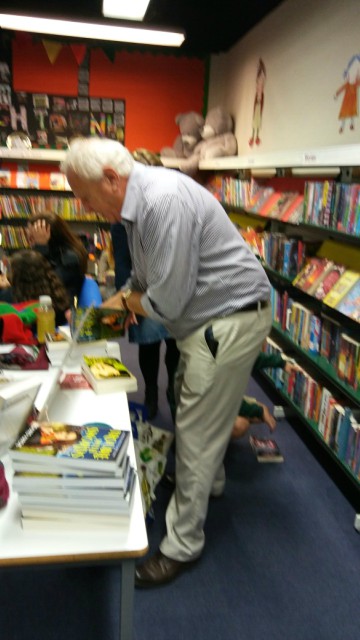 Eastleigh Library - Richard signing both of his books for a fan