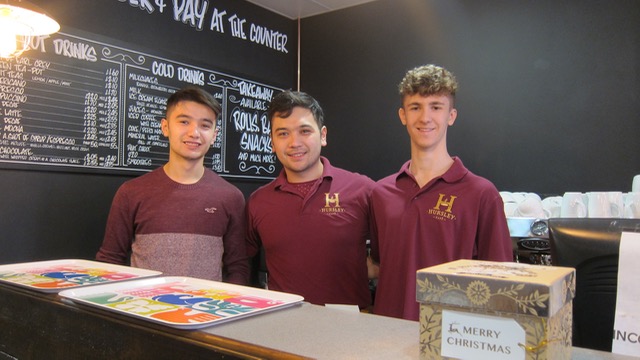 Malik (centre) and his friendly colleagues: Hursley Cafe
