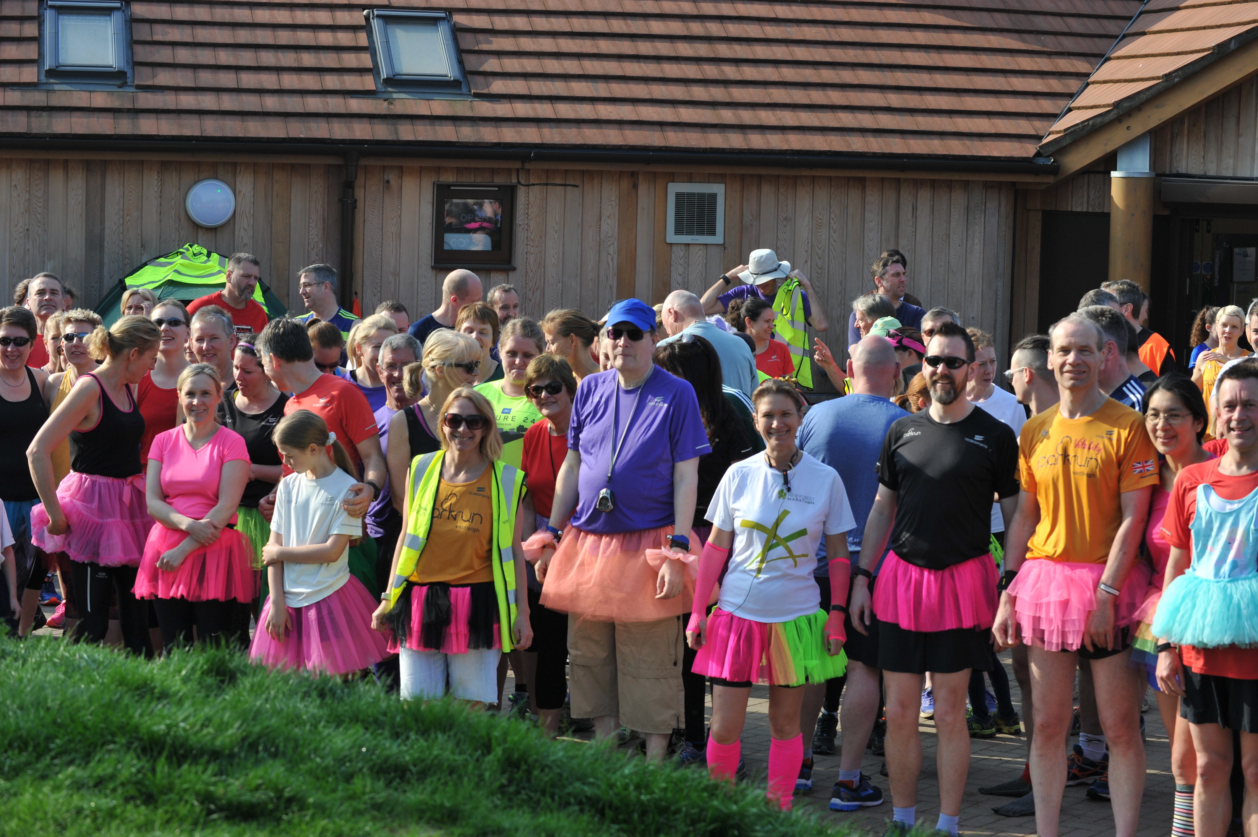 A group of parkrunners display their tutus at the event briefing for the 400th Eastleigh parkrun